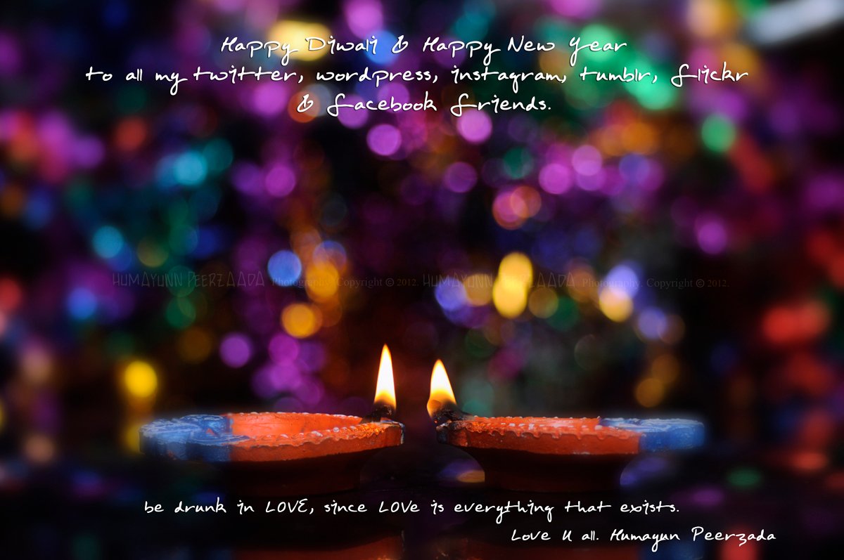 Two glowing diyas set against a colorful bokeh background, symbolizing the spirit of Diwali and the joy of New Year celebrations.