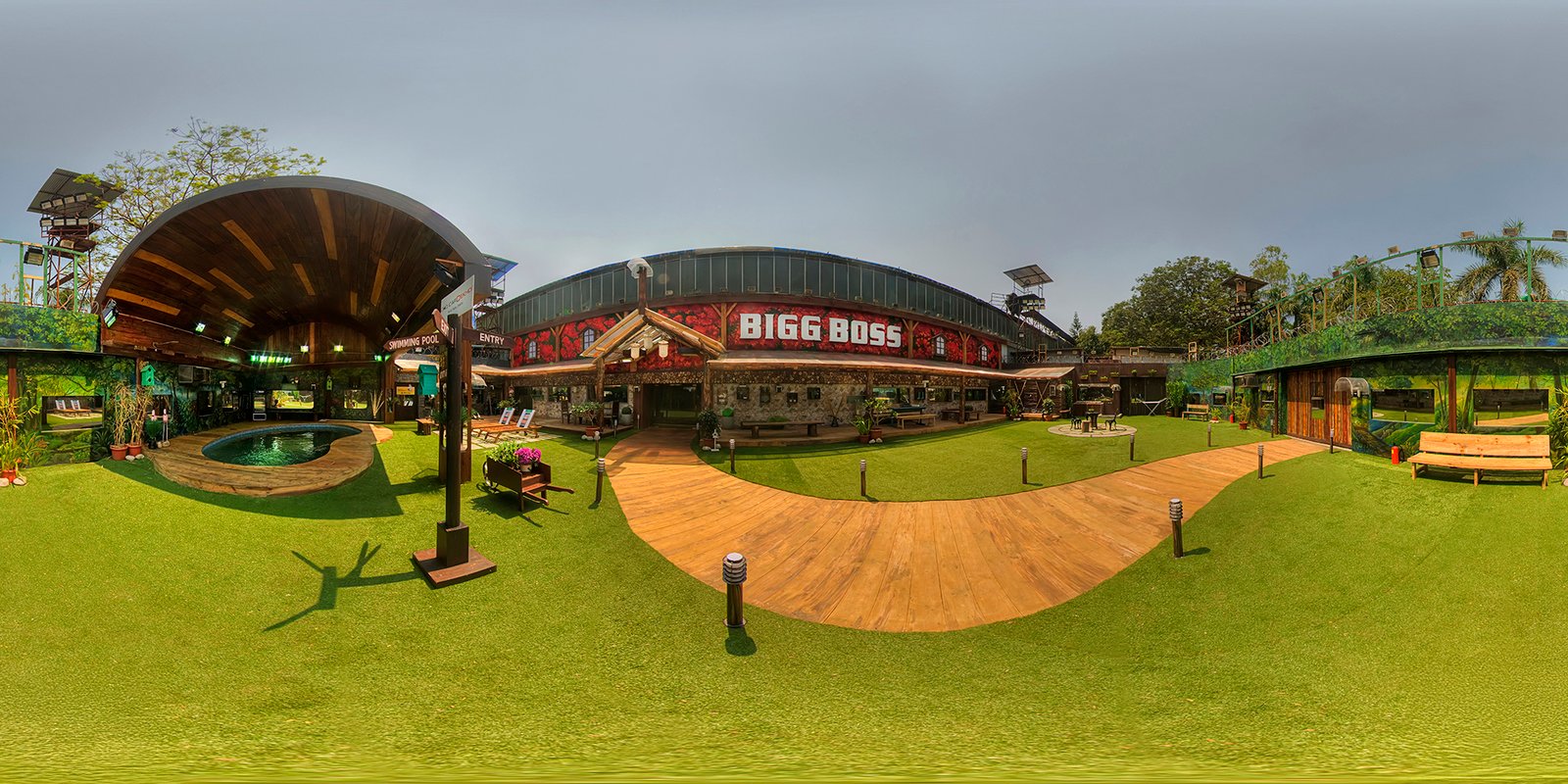 360° panoramic view of the Bigg Boss House — Season 8, featuring vibrant architecture, garden space, and colorful design elements.