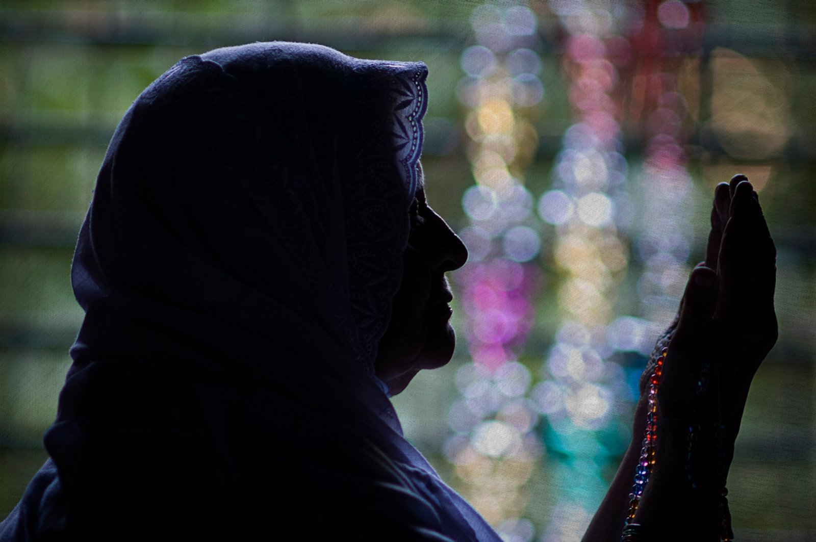 Silhouette portrait of Humayun Peerzaada’s mother in prayer, symbolizing love, blessings, and the eternal strength of a mother.