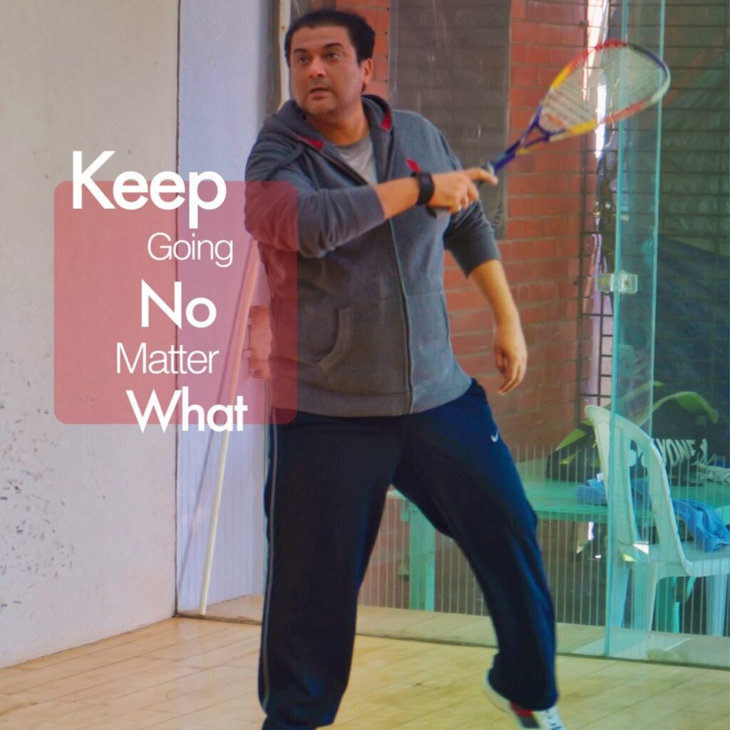 Humayun Peerzaada playing squash with the motivational quote ‘Keep going no matter what.