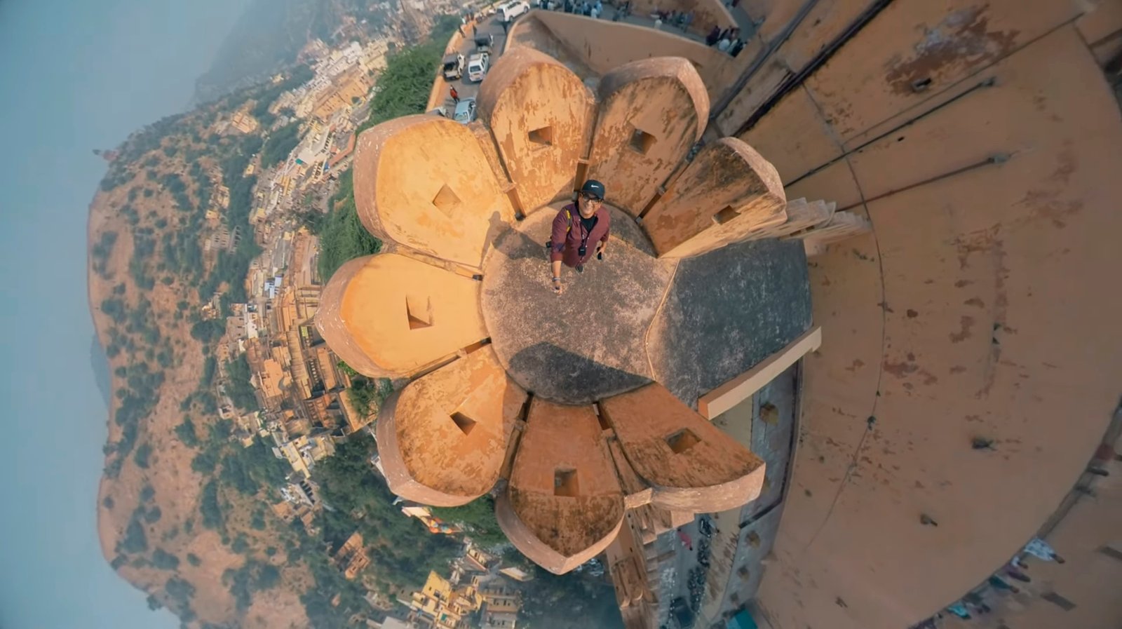 360° tiny planet aerial view of Amer Fort, Jaipur — Humayunn Peerzaada at the center, surrounded by the fort’s Rajput architecture and hillside landscape.