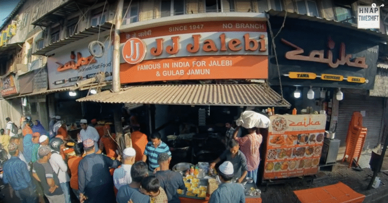 Crowded street scene of Maulana Shaukat Ali Road (JJ Junction), Mumbai during Ramzan — bustling shops, food stalls, and festive energy, captured before the area went into redevelopment.