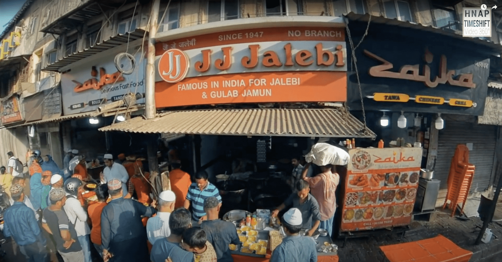 Crowded street scene of Maulana Shaukat Ali Road (JJ Junction), Mumbai during Ramzan — bustling shops, food stalls, and festive energy, captured before the area went into redevelopment.