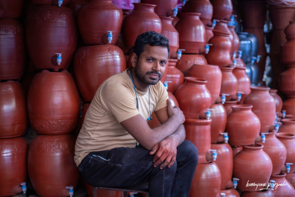 Portrait of an earthen pot seller at Matka Galli, Null Bazaar — where tradition meets the everyday rhythm of Mumbai.