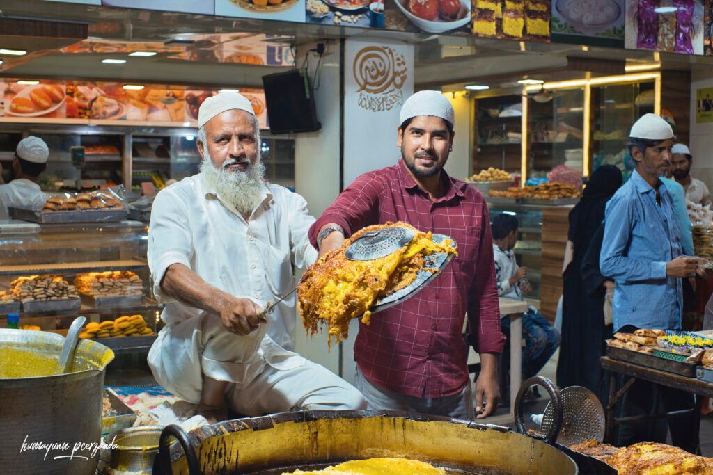 Suleman Mithaiwala at Mohammed Ali Road, Mumbai — capturing the warmth of Ramzan Iftar, where food, faith, and togetherness fill the night with light and fragrance.
© Humayun Peerzaada — All photos captured with heart and lens.