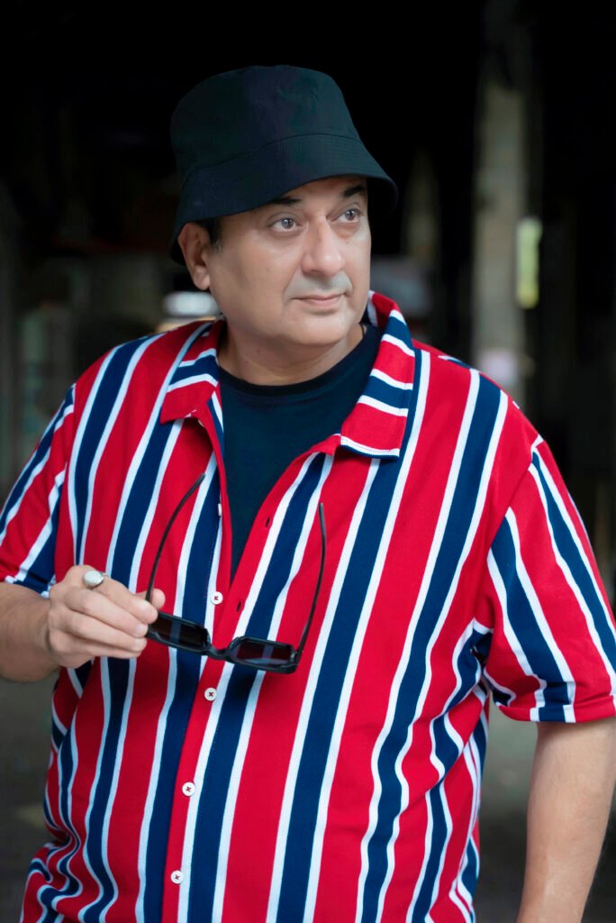 Man wearing red striped casual shirt with cap – stylish everyday men’s outfit look