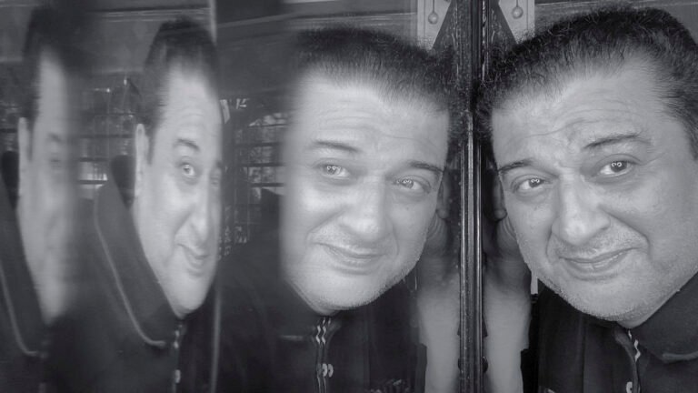Black and white mirror self-reflection portrait of a man with multiple reflections, symbolizing life, emotions, and inner thoughts