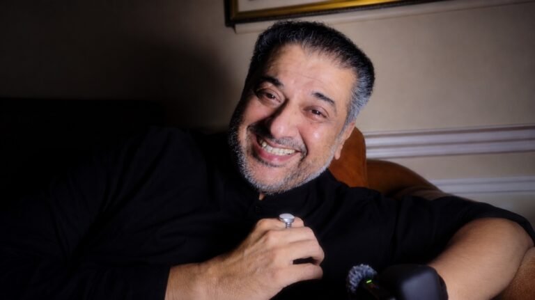 Humayunn Peerrzaada smiling during a casual home singing session.