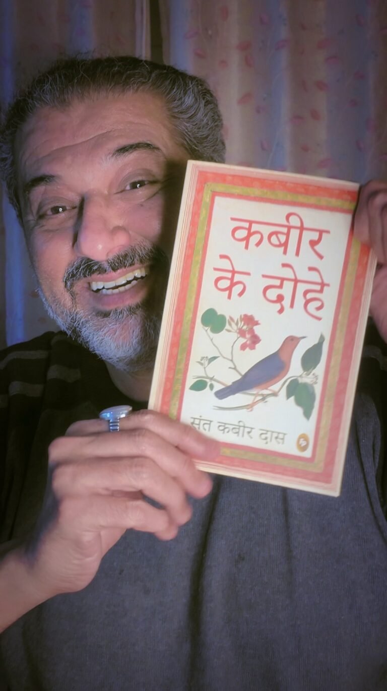 Humayun Peerzada holding a book of Kabir ke Dohe