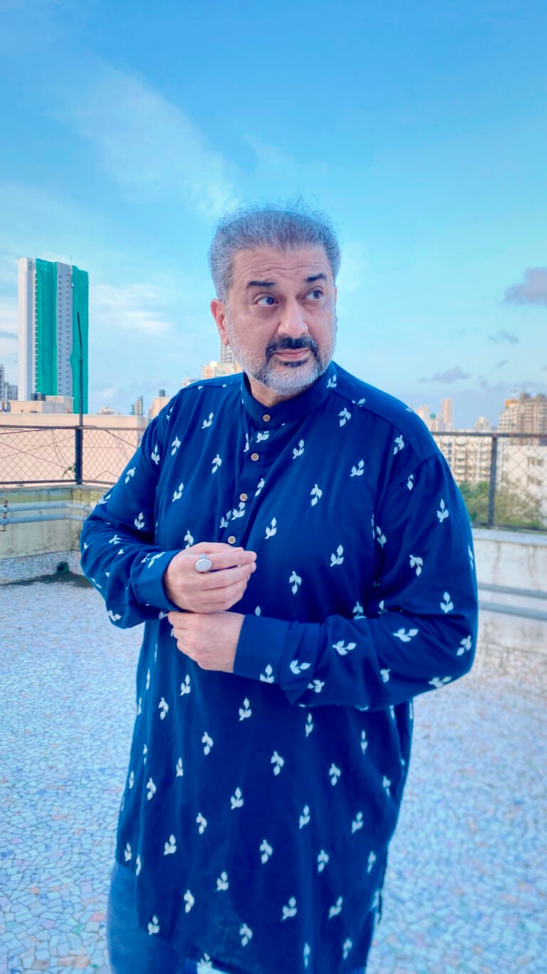 Humayun wearing a blue printed Anouk kurta with jeans on a Mumbai rooftop